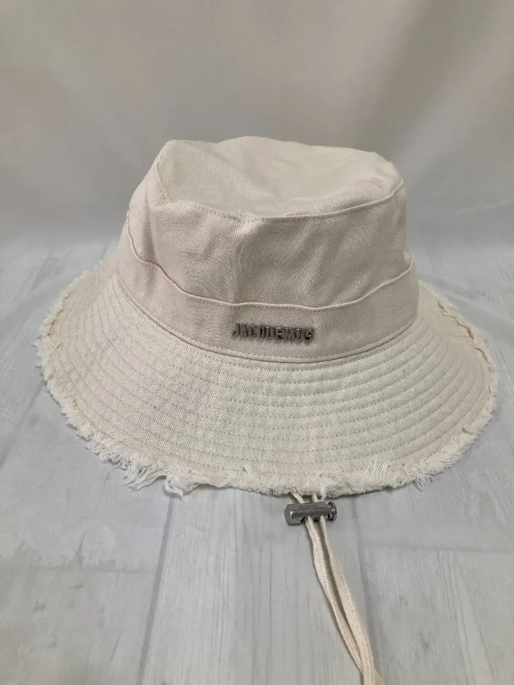 Jacquemus Cream Frayed Brim Bucket Hat Metal Logo Adjustable Chin Strap